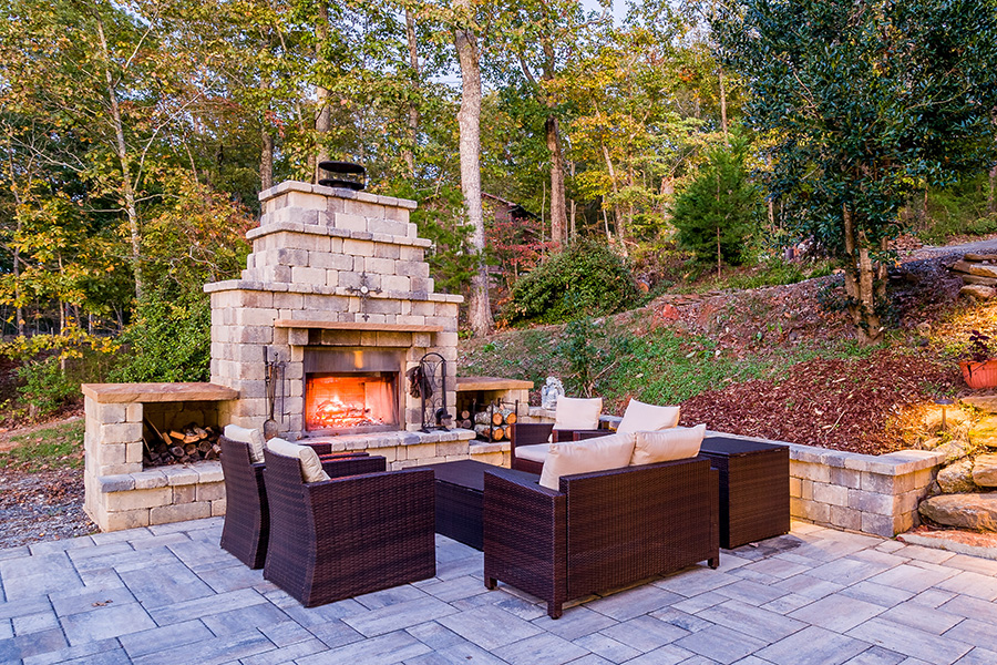Outdoor Fireplace made of elegant stone/brick design, with storage for firewood, comfy chairs around, on flagstone patios with natural stone steps - Lebanon, IL