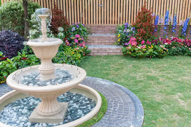 Backyard garden with brick steps, hardscaping, fountain, elegant landscaping - Lebanon, IL